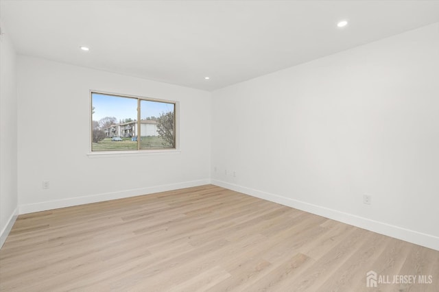 511 Bradley Ct, South Brunswick, NJ 08540 - unfurnished room featuring light wood finished floors, baseboards, and recessed lighting