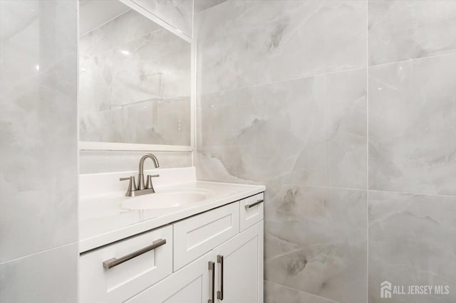 511 Bradley Ct, South Brunswick, NJ 08540 - bathroom featuring tile walls and vanity