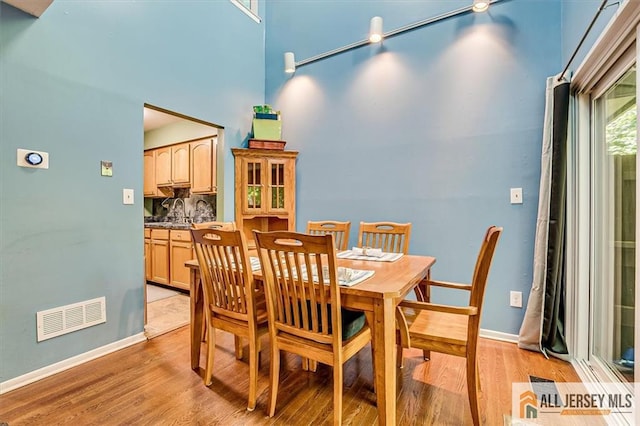 76 Letts Ct Unit 167, Old Bridge, NJ 07747 - dining space with light wood finished floors and a high ceiling