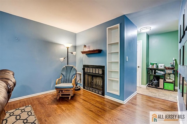 76 Letts Ct Unit 167, Old Bridge, NJ 07747 - living area featuring a fireplace and wood finished floors