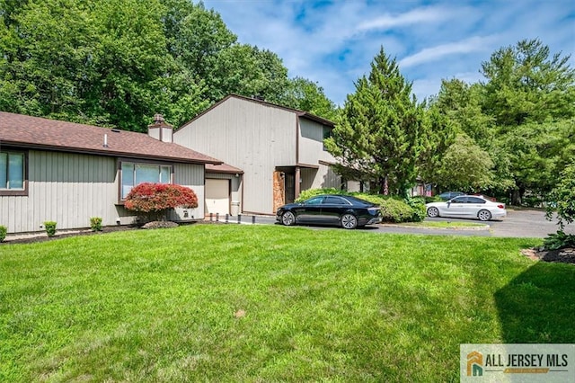 76 Letts Ct Unit 167, Old Bridge, NJ 07747 - view of grassy yard featuring an attached garage