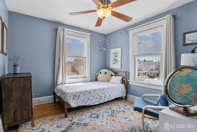 31 Riva Ave, Milltown, NJ 08850 - bedroom with wood finished floors, baseboards, and ceiling fan