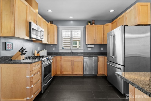 31 Riva Ave, Milltown, NJ 08850 - kitchen featuring stainless steel appliances, recessed lighting, a sink, dark tile patterned flooring, and dark stone counters