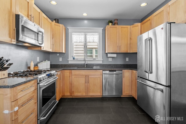 31 Riva Ave, Milltown, NJ 08850 - kitchen featuring stainless steel appliances, a sink, recessed lighting, dark tile patterned flooring, and dark stone counters