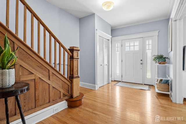 31 Riva Ave, Milltown, NJ 08850 - foyer entrance featuring light wood-style flooring, stairs, baseboards, and ornamental molding