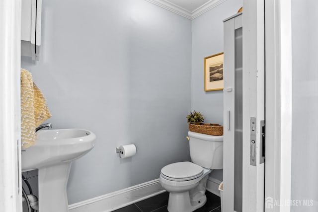 31 Riva Ave, Milltown, NJ 08850 - half bath featuring crown molding, baseboards, toilet, and tile patterned flooring