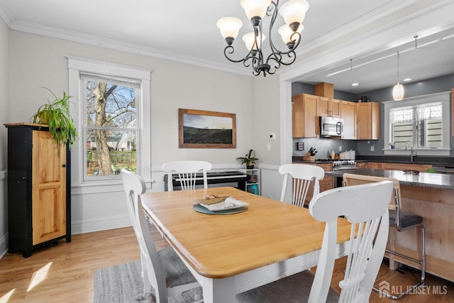 31 Riva Ave, Milltown, NJ 08850 - dining room featuring a chandelier, light wood-style flooring, ornamental molding, and baseboards