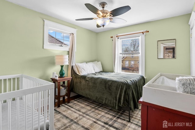 31 Riva Ave, Milltown, NJ 08850 - bedroom with multiple windows and ceiling fan