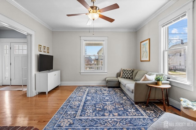 31 Riva Ave, Milltown, NJ 08850 - living room with plenty of natural light, wood finished floors, baseboards, and ornamental molding