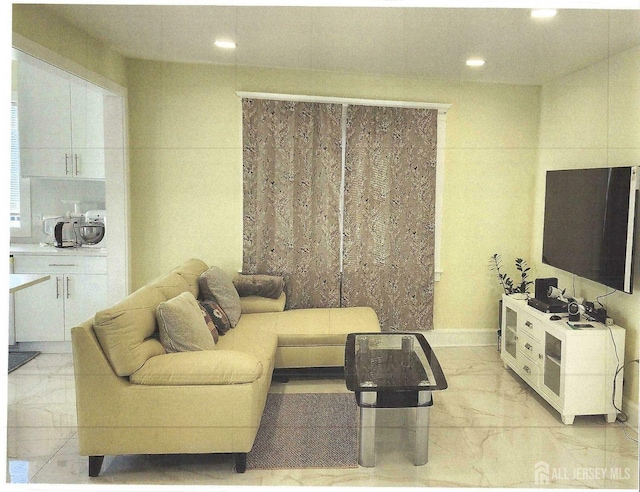 living room with recessed lighting and marble finish floor