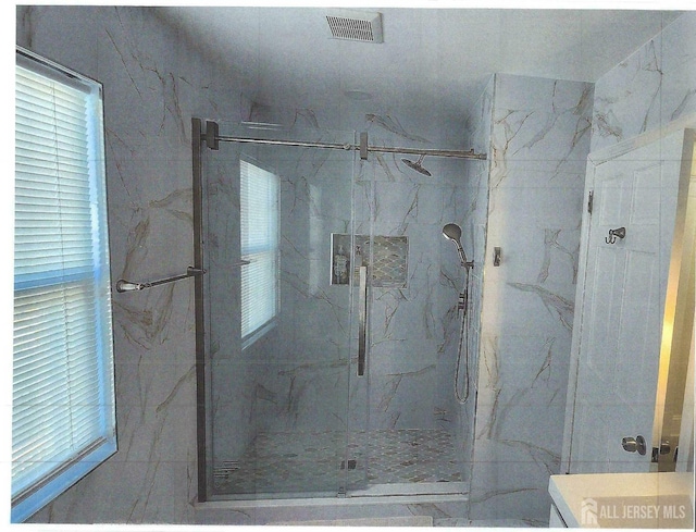 307 Poll Pl, Edison, NJ 08817 - full bathroom featuring a marble finish shower and plenty of natural light