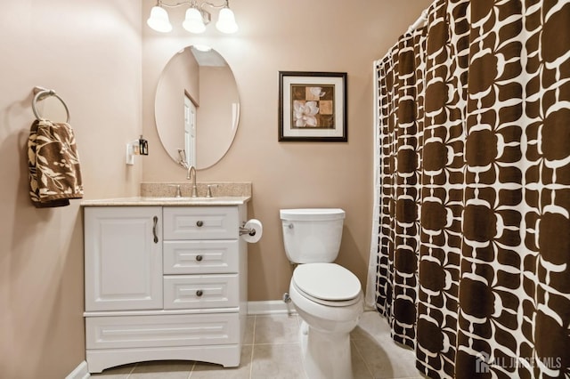 bathroom featuring curtained shower, toilet, vanity, and tile patterned flooring