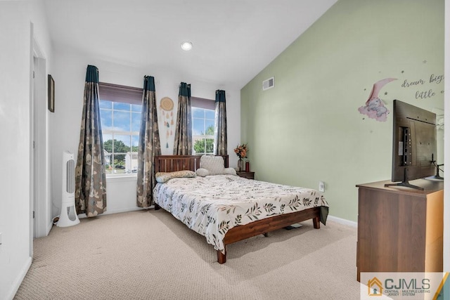 bedroom featuring lofted ceiling and carpet floors