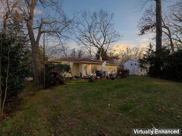 view of yard at dusk