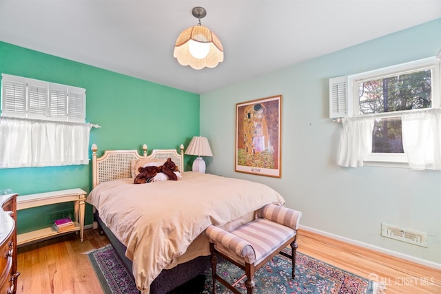 bedroom featuring wood-type flooring