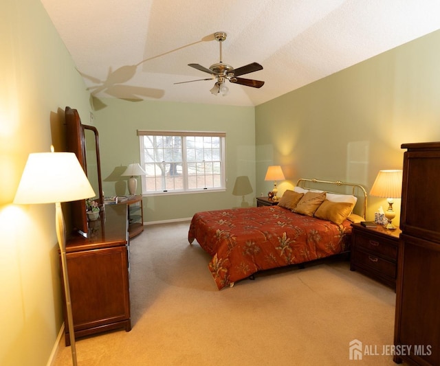 bedroom with lofted ceiling, light carpet, baseboards, and a ceiling fan