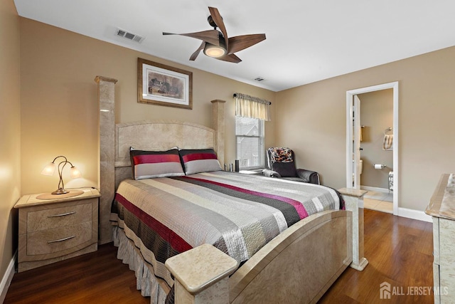 bedroom featuring visible vents, dark wood-style flooring, baseboards, and ensuite bathroom
