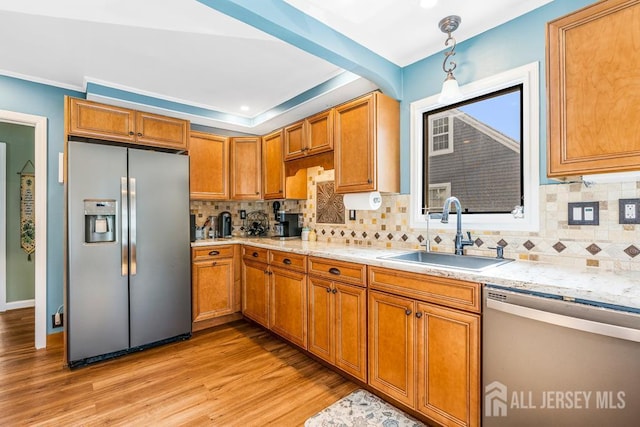 229 Harris Ave, Middlesex, NJ 08846 - kitchen featuring stainless steel appliances, light wood-style flooring, brown cabinetry, tasteful backsplash, and crown molding