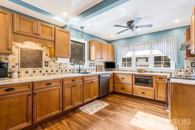 229 Harris Ave, Middlesex, NJ 08846 - kitchen with brown cabinetry, backsplash, wood finished floors, light stone countertops, and appliances with stainless steel finishes