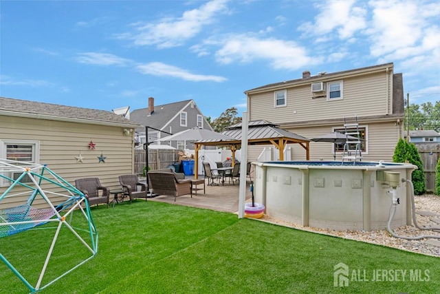 229 Harris Ave, Middlesex, NJ 08846 - rear view of house featuring a gazebo, a fenced backyard, a patio area, and an outdoor living space