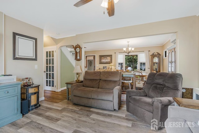 229 Harris Ave, Middlesex, NJ 08846 - living area featuring a chandelier, light wood-style flooring, a ceiling fan, and crown molding