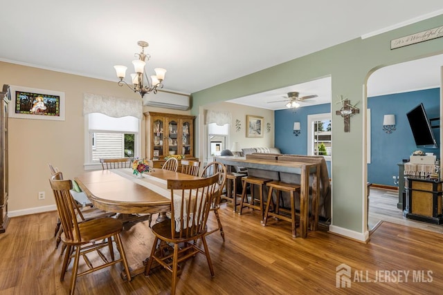 229 Harris Ave, Middlesex, NJ 08846 - dining area featuring plenty of natural light, wood finished floors, a chandelier, and ornamental molding