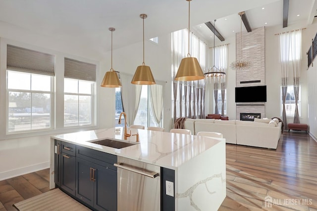 21 Cole Pl, Cranbury, NJ 08512 - kitchen featuring a sink, plenty of natural light, light wood finished floors, baseboards, and beamed ceiling