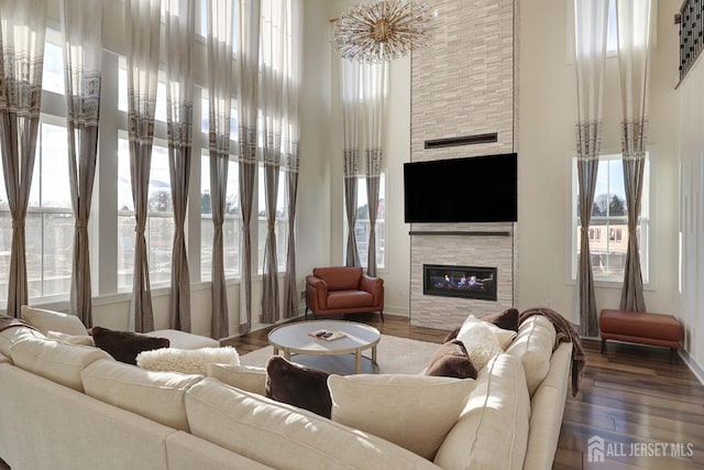 21 Cole Pl, Cranbury, NJ 08512 - living area featuring a towering ceiling, a fireplace, baseboards, and wood finished floors