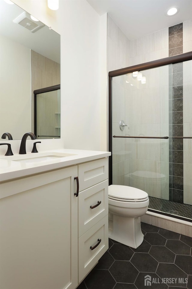 21 Cole Pl, Cranbury, NJ 08512 - bathroom featuring toilet, tile patterned floors, a shower stall, vanity, and recessed lighting