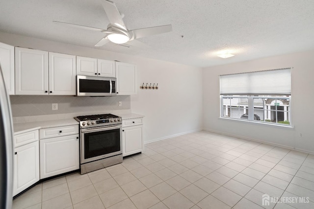 116 Prestwick Way, Edison, NJ 08820 - kitchen featuring stainless steel appliances, light countertops, decorative backsplash, white cabinets, and a textured ceiling