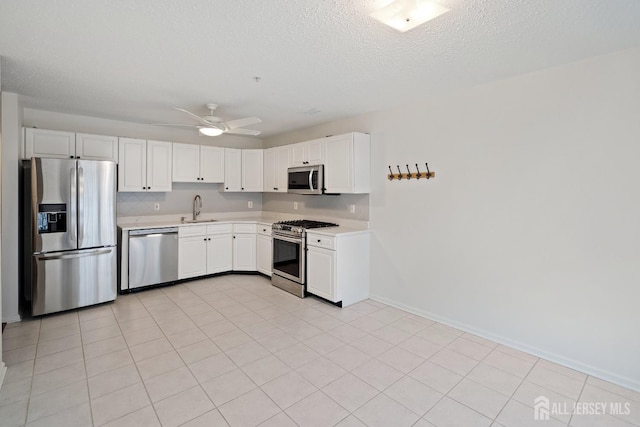 116 Prestwick Way, Edison, NJ 08820 - kitchen featuring stainless steel appliances, light countertops, ceiling fan, white cabinets, and a textured ceiling