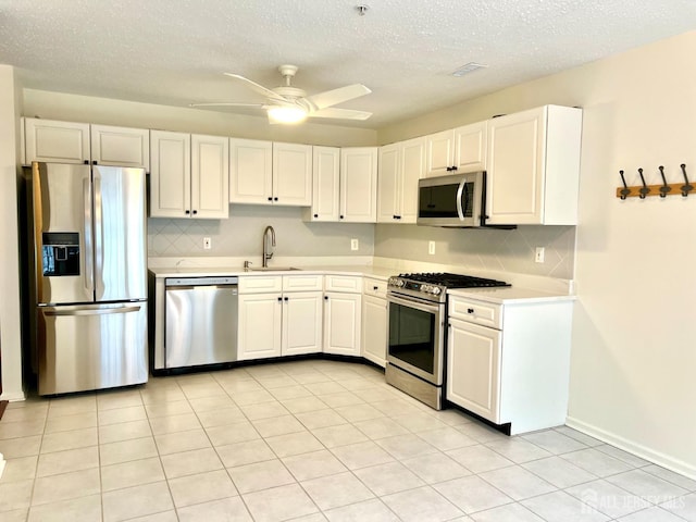 116 Prestwick Way, Edison, NJ 08820 - kitchen with stainless steel appliances, backsplash, light countertops, a ceiling fan, and a textured ceiling
