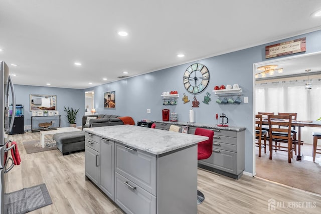 19 Ellen Cir, Old Bridge, NJ 08857 - kitchen featuring gray cabinetry, light wood finished floors, a center island, recessed lighting, and open floor plan