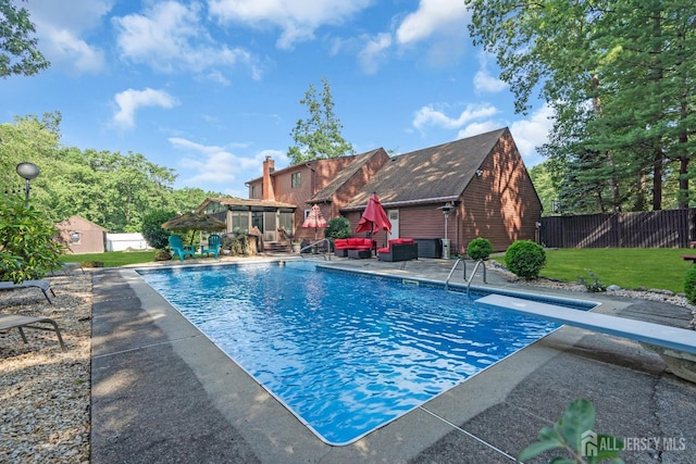 19 Ellen Cir, Old Bridge, NJ 08857 - view of pool with a patio area, a diving board, and an outdoor structure