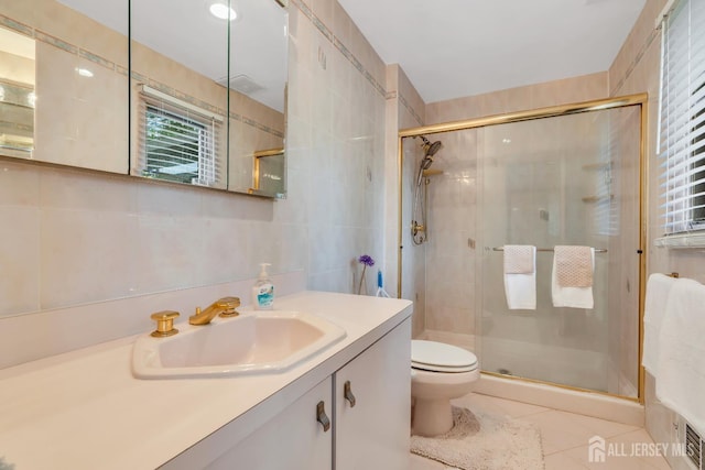 19 Ellen Cir, Old Bridge, NJ 08857 - bathroom with tile walls, tile patterned floors, a stall shower, and vanity