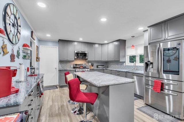 19 Ellen Cir, Old Bridge, NJ 08857 - kitchen featuring stainless steel appliances, gray cabinetry, light wood finished floors, backsplash, and recessed lighting