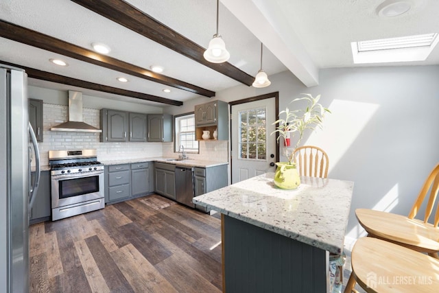201 Summit Ave, Fords, NJ 08863 - kitchen with wall chimney range hood, appliances with stainless steel finishes, a skylight, gray cabinets, and recessed lighting