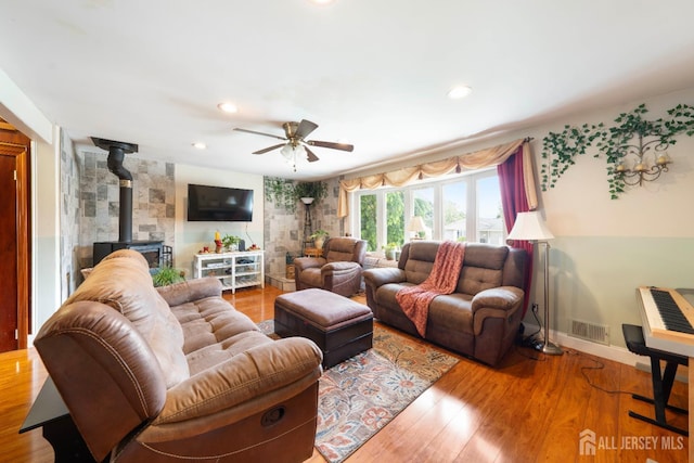 201 Summit Ave, Fords, NJ 08863 - living area featuring a ceiling fan, wood finished floors, a wood stove, and recessed lighting