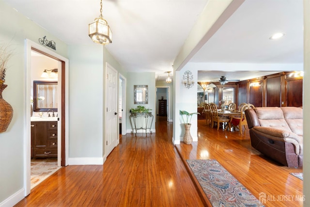 201 Summit Ave, Fords, NJ 08863 - corridor with wood finished floors and a chandelier