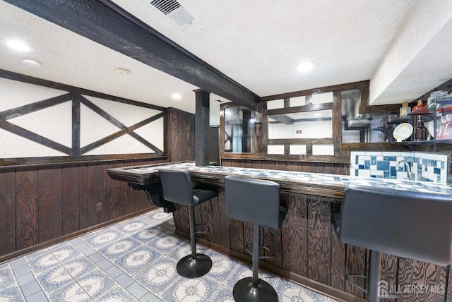 201 Summit Ave, Fords, NJ 08863 - bar featuring wooden walls, a textured ceiling, and recessed lighting
