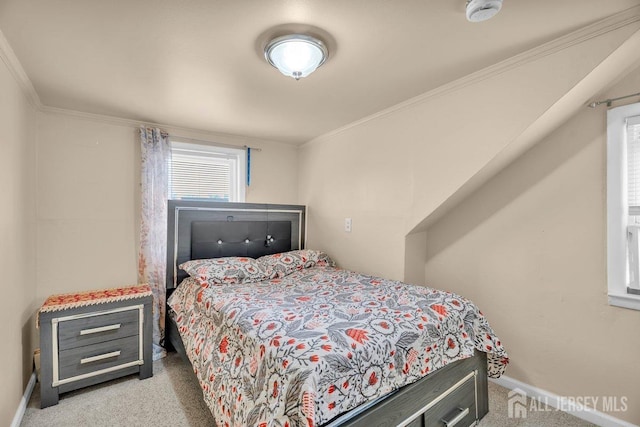 carpeted bedroom with ornamental molding