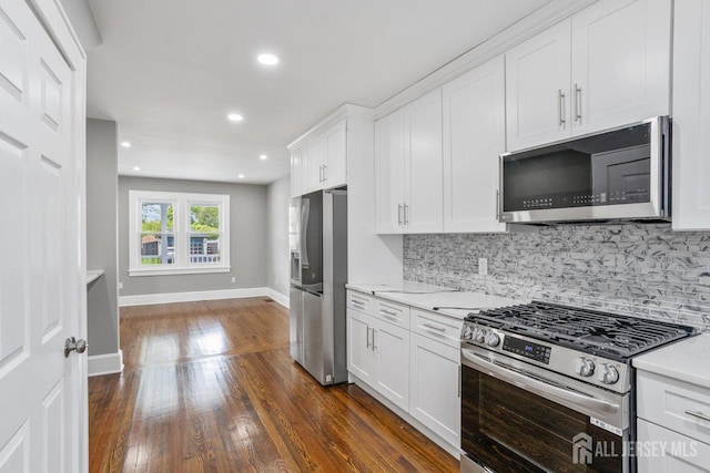 118 Hillside Ave, Woodbridge Proper, NJ 07095 - kitchen with stainless steel appliances, backsplash, dark wood-style flooring, white cabinetry, and recessed lighting
