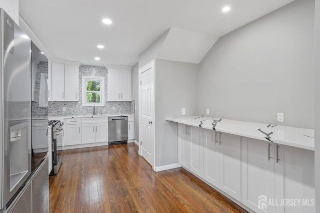 118 Hillside Ave, Woodbridge Proper, NJ 07095 - kitchen featuring appliances with stainless steel finishes, dark wood-style floors, backsplash, recessed lighting, and white cabinetry