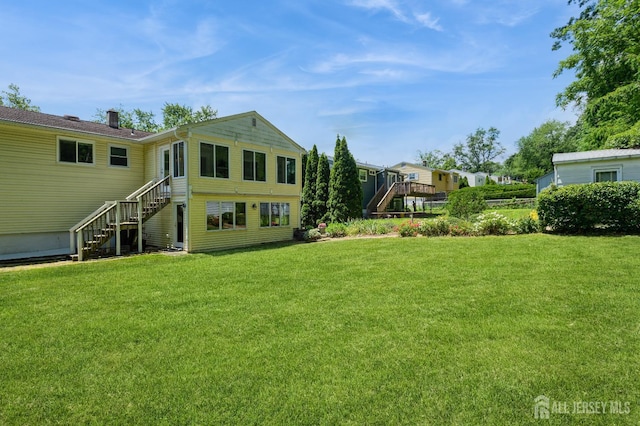 34 Bartman Rd, East Brunswick, NJ 08816 - back of property featuring stairway and a yard
