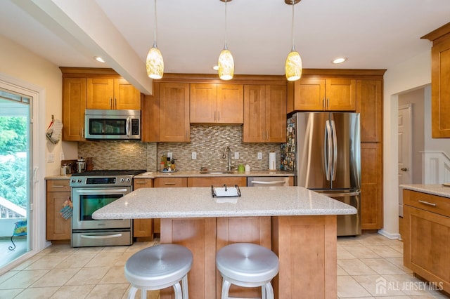 34 Bartman Rd, East Brunswick, NJ 08816 - kitchen featuring appliances with stainless steel finishes, brown cabinetry, light tile patterned floors, tasteful backsplash, and recessed lighting