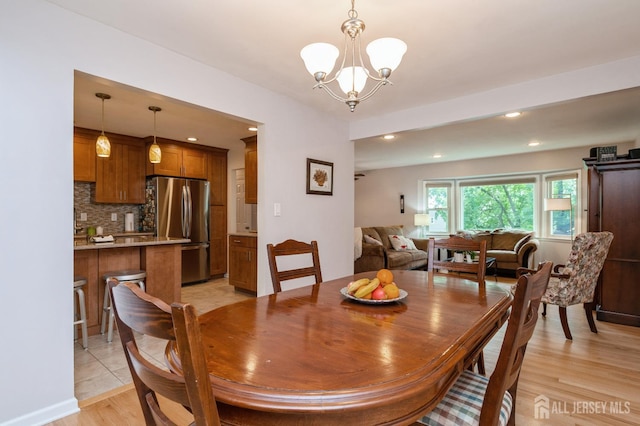 34 Bartman Rd, East Brunswick, NJ 08816 - dining area with a chandelier, light wood finished floors, and recessed lighting