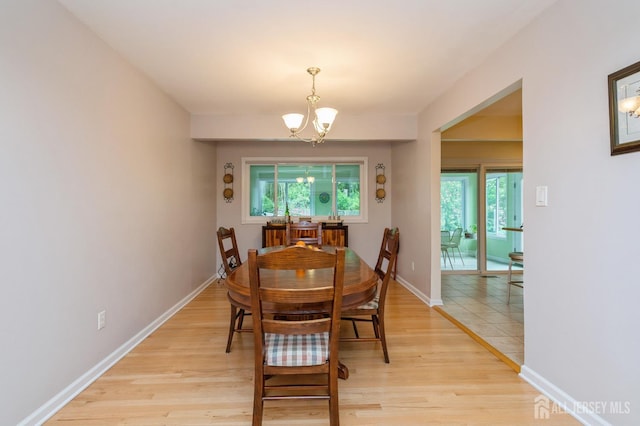 34 Bartman Rd, East Brunswick, NJ 08816 - dining room with a chandelier, light wood-style floors, and plenty of natural light