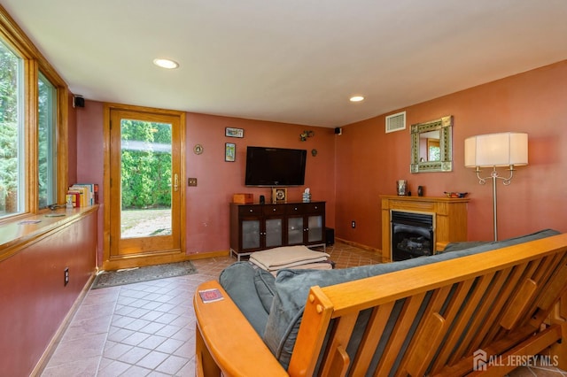 34 Bartman Rd, East Brunswick, NJ 08816 - tiled living room with recessed lighting and a glass covered fireplace
