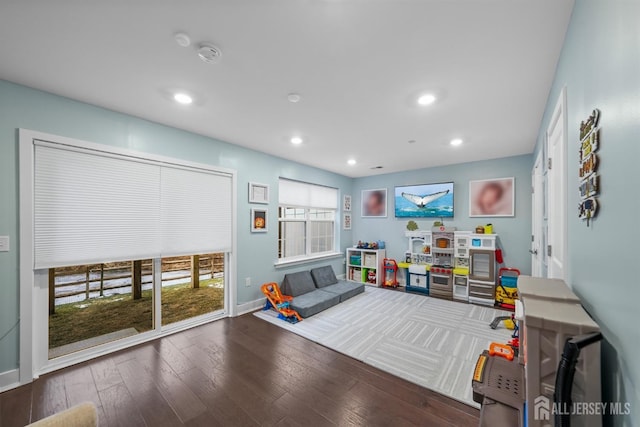 game room with recessed lighting, baseboards, and wood-type flooring