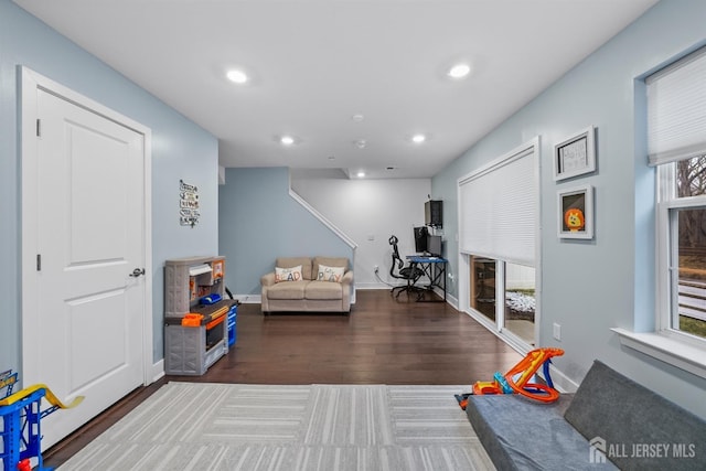 game room featuring recessed lighting, wood finished floors, and baseboards